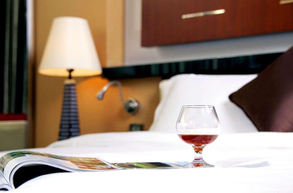 Grand Oriental Hotel Дунгуань Номер фото